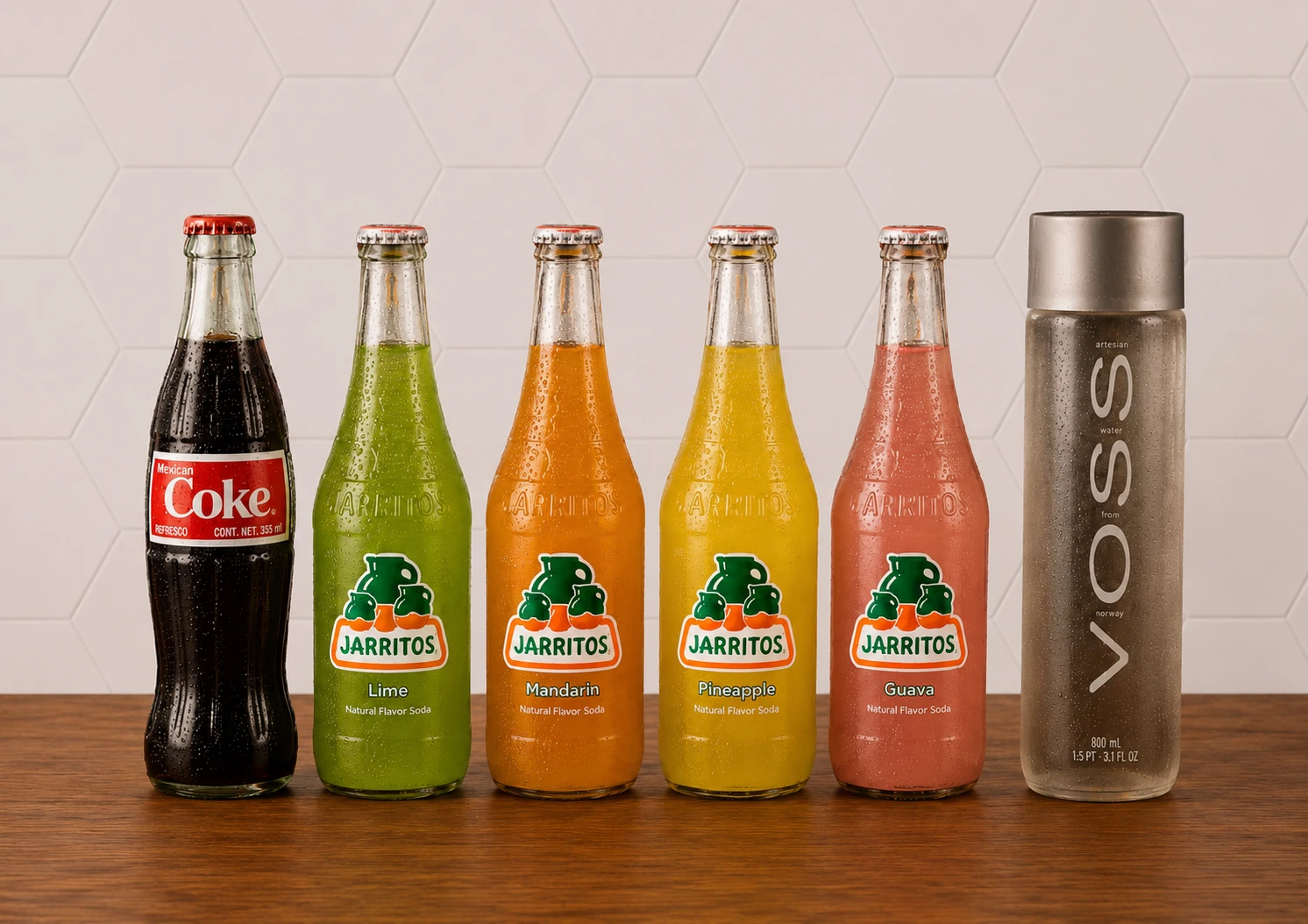 Assorted bottled soft drinks and beverages displayed for restaurant menu offerings.