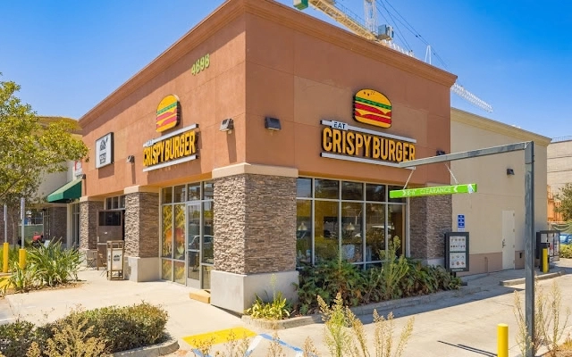 Exterior view of a Burger King restaurant featuring a prominent "Burger King" sign.